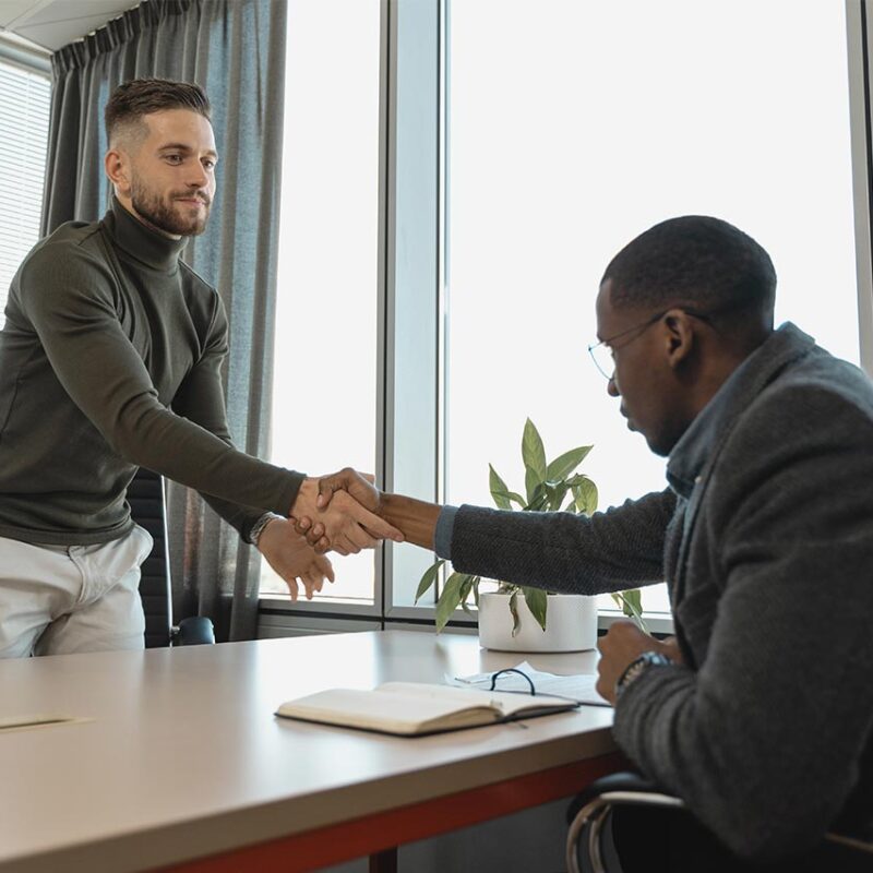 job interview two men shaking hands